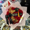 24 red long stem roses with with graduation accessories. Please note color