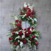 Pay tribute with this red and white spray. Made up of roses