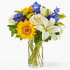 This celestial blend of white, yellow, and blue flowers evokes the beauty