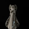 This angel is perfect to brighten a dim area in your home.