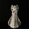 This angel is perfect to brighten a dim area in your home.