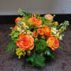 This vibrantly colored yellow and orange arrangement is sure to delight any