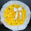 gorgeous yellow roses wrapped in beautiful white floral paper. and topped off