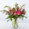 Fairytale&ndash;pink roses, hot pink alstroemeria, and pink snapdragons make an enchanting bouquet
