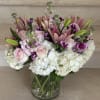 A lush and romantic mix of soft blush roses, white hydrangeas, star