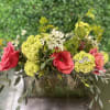 This bright and cheerful arrangement is sure to make your mom smile!