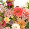 Featuring rich orange, coral, and peach colors that aim to capture the