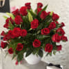 Overflowing with timeless beauty, this stunning floral arrangement features 50 long-stem red