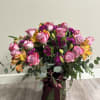 A delicate embrace of lilac roses with a touch of purple, united