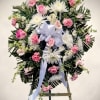 A tender and elegant tribute, our Pink Grace Standing Spray combines soft