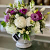 The Mia Arrangement comes in a stunning masonry pedestal container, adding an