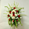 This Standing Spray Includes White Gladiolas, Bells of Ireland, White Larkspur, White