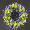 A 24&quot; wreath packed with bells of ireland, green trick, mums, hydrangeas
