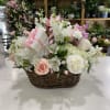 This floral arrangement consists of roses, carnations, hydrangeas, stock alstroemerias and more.