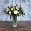The soft subtle colors of this bouquet will make you think of