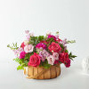 Inspired by bright shades and soft textures, this arrangement will wow your