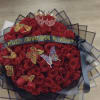 this is our Classic Ramo Buchon, containing classical Red Roses with Baby&#039;s
