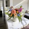 Container may vary. Colors are designer choice and based on seasonality and