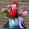 Psychadelic Holographic box arrangement filled to the brim with vibrant colorful roses