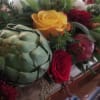 Fall colored flowers such as Sunflowers, Roses, Mums and, seasonal fruit or