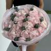 A breathtaking bouquet of blush pink ranunculus, each bloom delicately layered like