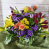 SPECIAL. Available in cooler, purple tulip, orange mini roses, yellow lilies, red