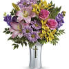 Gracefully presented in a shining, silver-finished ceramic vase with cross cut-out, this