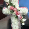 PopPINK AND WHITE ROSES AND CARNATIONS ACCENTED WITH BABYS BREATH AND A