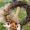 Grapevine wreath (12&quot;) with decorated with grasses, seed pods, dried flowers, wood