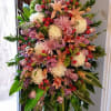 A lovely design of fresh lilies, mums, roses, stock and more in