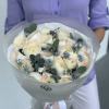 A dreamy arrangement of soft cream ranunculus with the faintest blush at