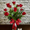 Indulge in classic beauty with our Passionate Roses arrangement, featuring one dozen