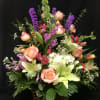 Beautiful spring flowers arranged in a wicker basket. Good for everyday occasions