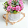 A beautiful floral box in delicate lavender tones, featuring elegant roses and