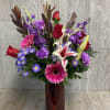 Tall one-sided classic arrangement for your special someone. Colors and flowers may