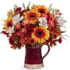 This blooming bouquet includes orange gerberas, white alstroemeria, maroon miniature carnations, bronze