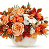 Elegant cr&egrave;me roses blend with the heartwarming hues of autumn in this