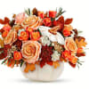 Elegant cr&egrave;me roses blend with the heartwarming hues of autumn in this