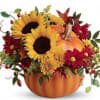 Rustic autumn flowers are stunning in a hand-painted ceramic pumpkin that looks