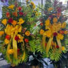 A beautiful combination of yellow and red roses and carnations with lavender