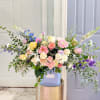 A burst of soft, delicate colors, this arrangement is an ode to