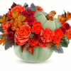 This arrangement features orange roses, spray orange roses, orange alstroemeria, orange carnations