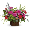 Pink and orange flowers in a wooden box