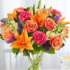 Bright colored flowers arranged in a garden vase 