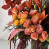 Flowers: kahala roses, orange roses, orange lilies, yellow ranunculus, seasonal autumn leaves