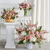 This prim pink set features elegant traditional arrangements fit for all kinds