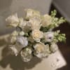 Remember Me is an all-white arrangement of seasonal blooms. Typically includes roses