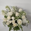 Remember Me is an all-white arrangement of seasonal blooms. Typically includes roses
