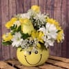 A bright, fun arrangement of white and yellow daisies and yellow roses