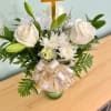 all white flower arrangement in a lovely glass vase is a beautiful